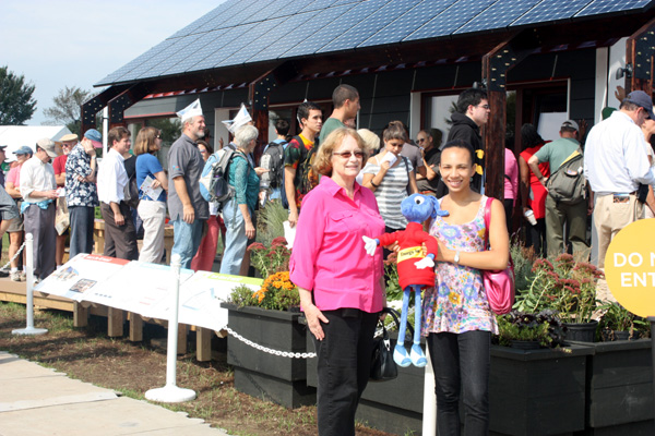 image of Energy Ant and friends in front of Team Massachusett's 4D Home.